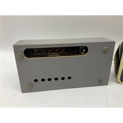 John Lennon interview recording conducted by John Hill student of Hull University on the 16th October 1964 at the A.B.C. Theatre Hull on behalf of the university newspaper 'Torchlight'. The interview lasts eight and a half minutes. It catches John in an upbeat breezy mood answering questions about the following topics: the song writing process ('sometimes you get an idea ....I dunno....my left leg.... and then write about that....'), recording (.... 'they just say - you're recording on such and such a date and they hope we turn up with some good songs written ....'), an alternative career path (.... 'I'd probably just have been a lay-about....'), failing at college (....'some other lads did my exams for me ....'), reading matter ( Clockwork Orange, Alice in Wonderland), his books of prose, tastes in music, the Blues, The Rolling Stones, being a Beatle vis-a-vis anonymity ('Whatever I'd be I'd choose to be rich .... who wants to walk down the street?').
The interview was recorded on 1/4 inch Emitape on a Fi-Cord Fidelity Recording machine. The reel-to-reel tape comes in its original Emitape plastic box and is accompanied by the Fi-Cord reel-to-reel machine on which the interview was originally recorded. Also included in this lot are a copy of the 'Torchlight' newspaper from 21st November 1964, two photographs of the interviewer with John Lennon (the interviewer is pictured to the left of John Lennon in the photograph in which John is signing a sketch) and one photograph of Paul McCartney with another reporter, the largest measures 12 x 16.5cm and a transcript of the interview. The recording is also accompanied by the original Fi-Cord tape recorder with microphone, four original 2v batteries and battery charger. The tape recorder has been adapted to take 3xAA batteries and the 2v battery charger is fitted with a standard UK 3-pin AC plug. The interview was recorded in the press room prior to the Beatles concert at the A.B.C. Theatre and is sold with copyright.