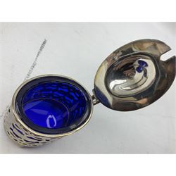 Silver mustard pot, hallmarked William Oliver, Birmingham 1900, oval form, with pierced decoration, the hinged cover and blue glass liner, together with silver plate salt and pepper shakers etc 