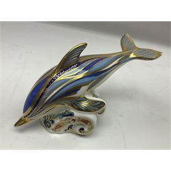 Three Royal Crown Derby paperweights, comprising Bottlenose Dolphin, Baby Bottlenose Dolphin and Striped Dolphin, all with gold stoppers 
