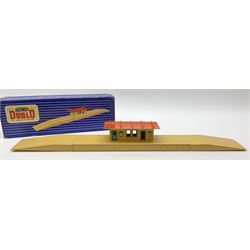 Hornby Dublo - six D1 accessories comprising Turntable; Through Station with white edges and separately boxed Platform Extension with Wall; Signal Cabin with orange roof and pack of station names; Level Crossing; and Island Platform; all boxed (6)
