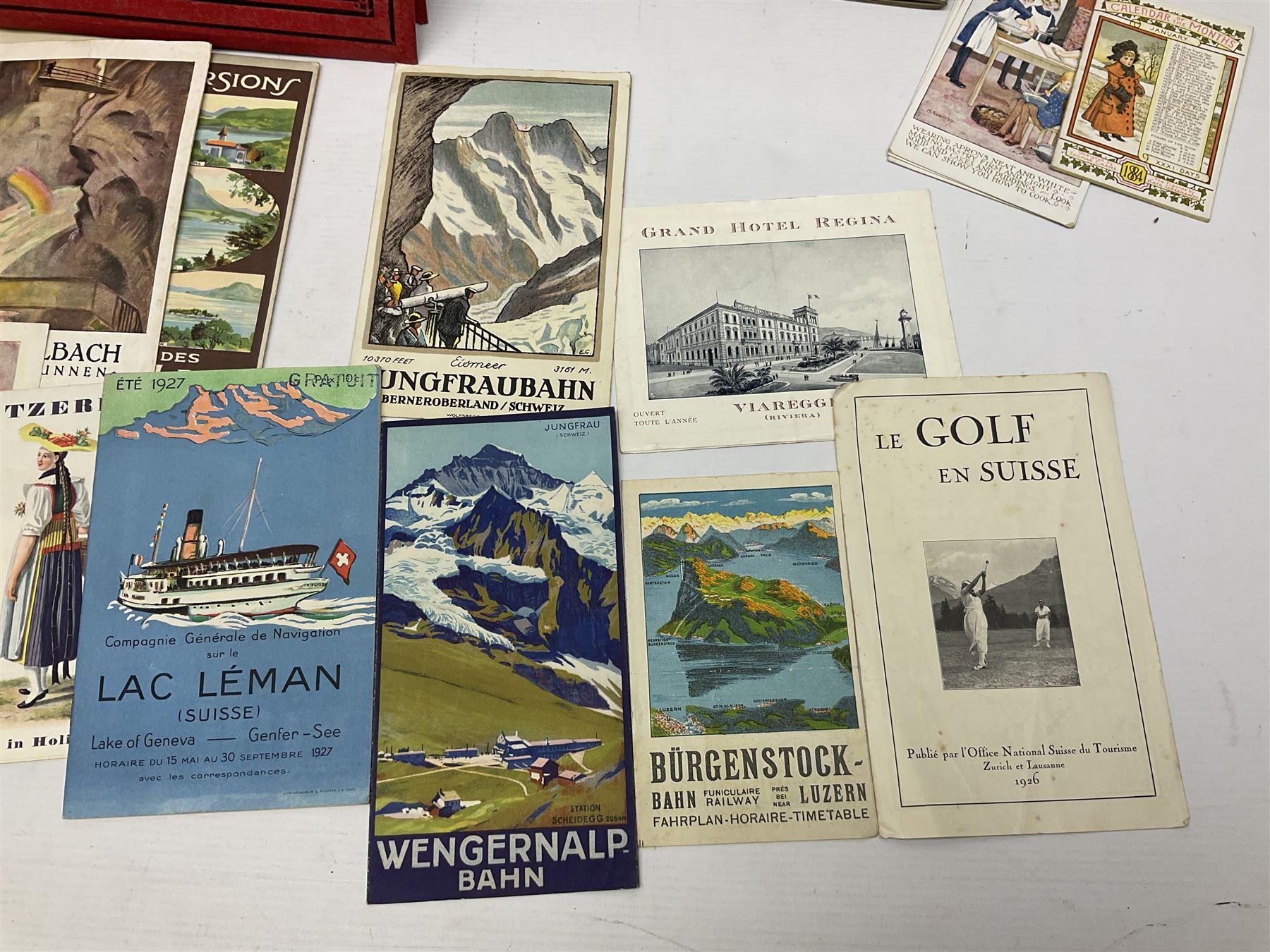 Early 20th century ephemera, to include signed photographs of Charles Boyer and Walter Pidgeon etc, a printed letter from Winston Churchill, two albums and a quantity of transfer books of Players and similar cigarette cards, including Boy Scout and Girl Guide Patrol Signs and Emblems and RAF Badges, a collection of greetings cards and postcards, a photograph album containing black and white photographs of Caius College Cambridge and guides and pamphlets on travelling Switzerland and the UK