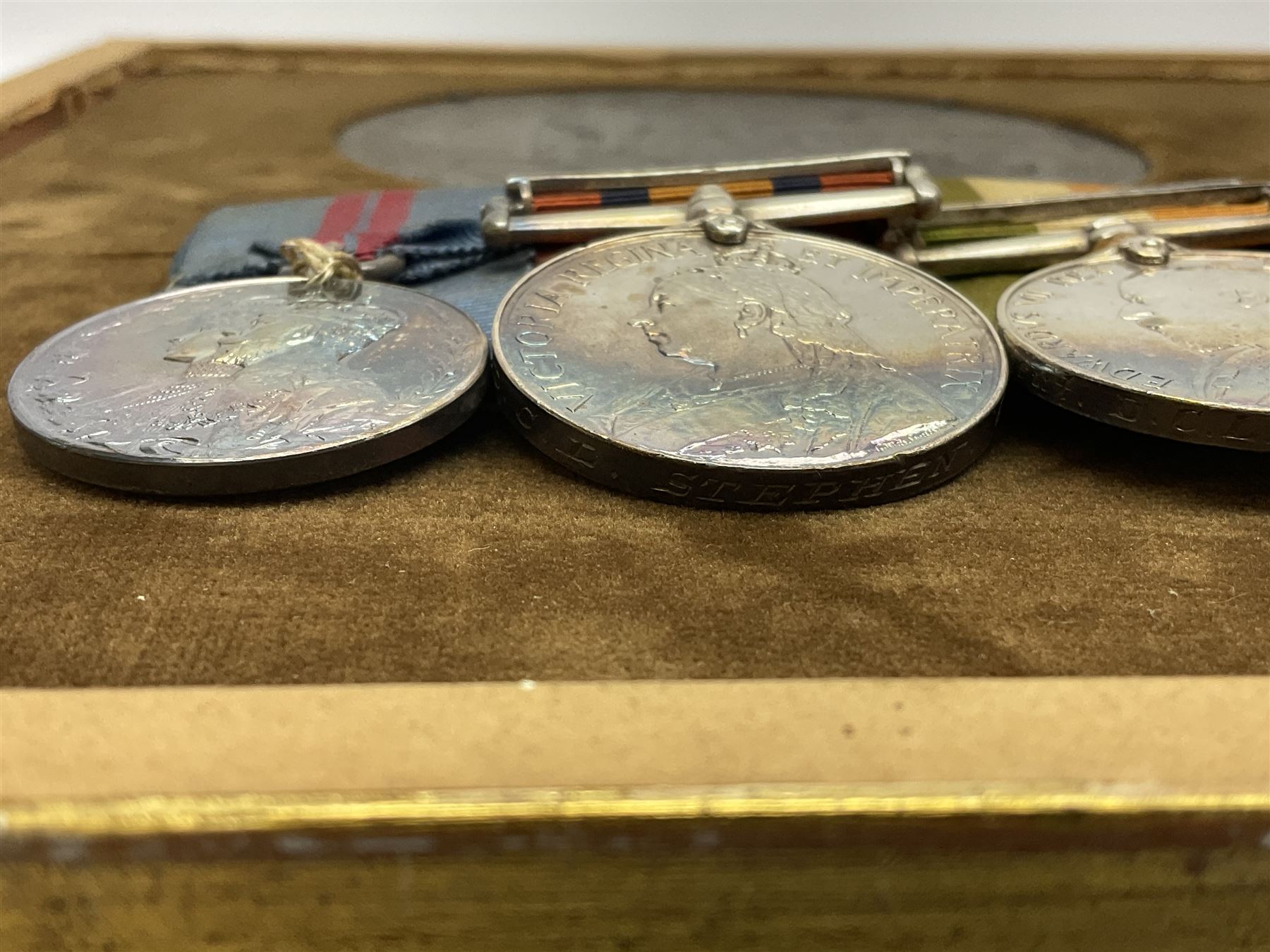 DOW Eure-et-Loir group of seven Boer War/WW1 medals comprising Queens South Africa Medal with three clasps for Cape Colony, Transvaal and Wittebergen, Kings South Africa Medal with two clasps for South Africa 1901 and South Africa 1902, Turkish Liakat Medal, George V Coronation Medal, 1914 Star with 5th Aug.-22nd Nov. 1914 bar, British War Medal and Victory Medal awarded to Captain Douglas Leslie Stephen Grenadier Guards; group of four Boer War and 1911 Coronation miniature medals; all with ribbons and later mounted and framed with his bronze memorial plaque;  together with Cecil Cutler (active 1886-1934) heightened watercolour three-quarter length portrait of Douglas in uniform, signed and dated 1915, 52 x 35cm; gilt frame; Auctioneers Note: Douglas was the elder brother of Albert Alexander Leslie Stephen (see previous lot) and died of wounds on 10th September 1914 in France.