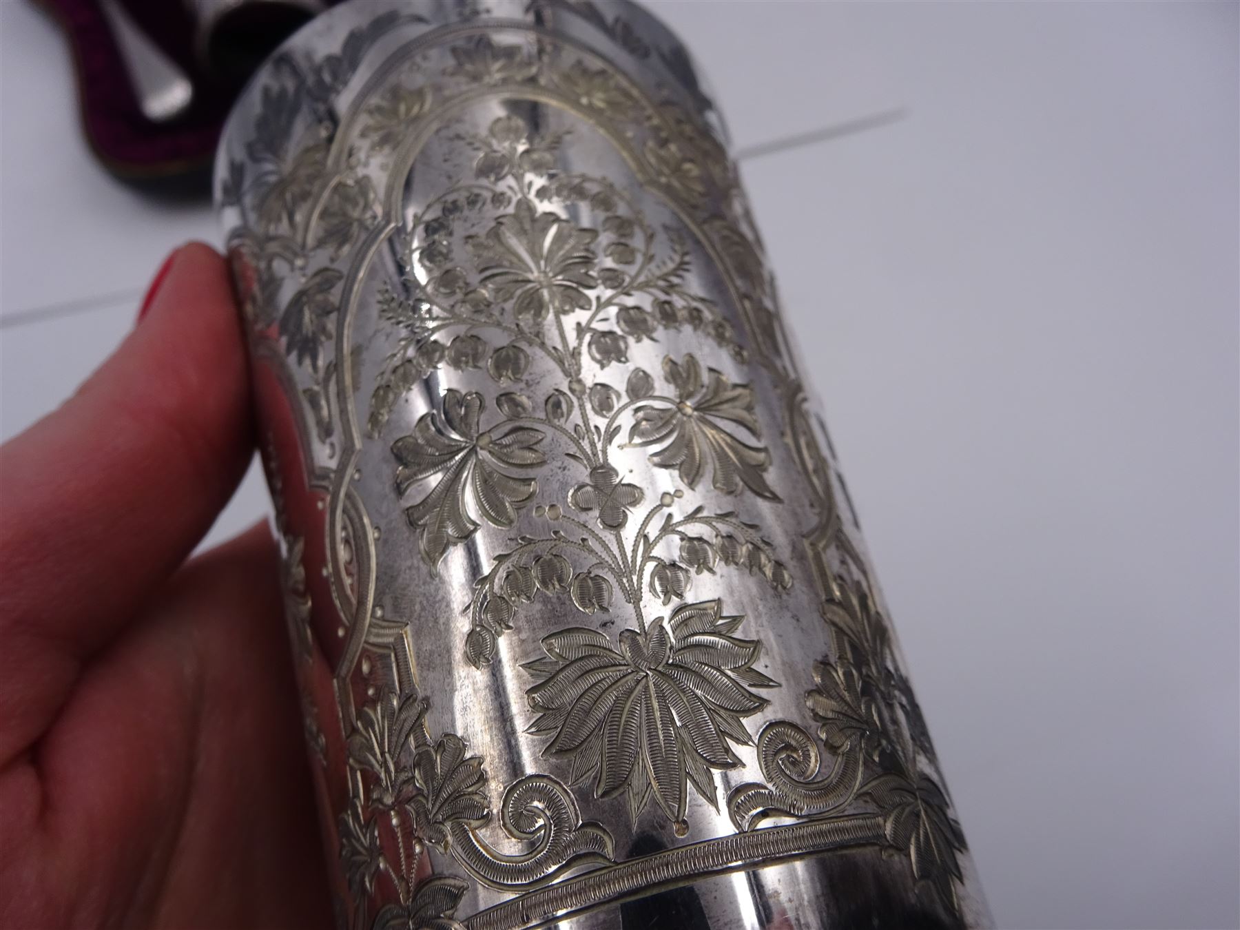 Victorian silver four piece christening set, comprising a beaker mug, napkin ring, fork and spoon, with bright cut floral decoration and monogrammed initials to each item, mug hallmarked Mappin & Webb (John Newton Mappin), Sheffield 1884, within tooled leather fitted case