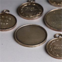 Seven 1920s Old English Sheepdog silver medals, all hallmarked, together with two further silver plated dog related medals