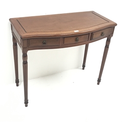  Chinese rosewood serpentine front side table, three drawers, turned tapering fluted supports, W92cm, H76cm, D46cm    