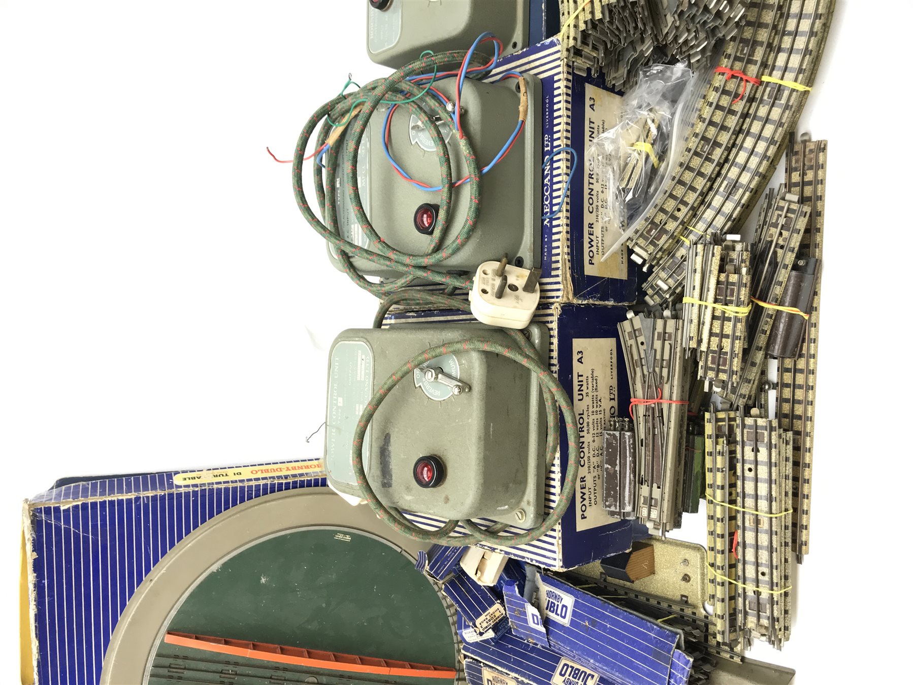 Hornby Dublo - three-rail electric track including boxed D1 turntable, boxed and loose points, boxed and loose switches, three power control units and  large quantity of loose sections