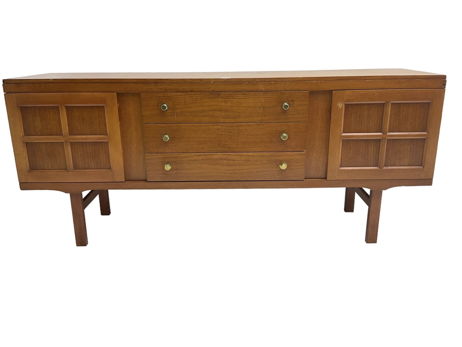 Elliotts of Newbury (EoN) - mid-20th century teak sideboard, fitted with three central drawers flanked by two cupboards, raised on square supports 