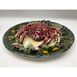 Two 20th Century Portuguese Palissy style Majolica wall plates, one depicting a crab, the other a lobster each to the centre modelled in relief surrounded by encrustations and shells, both with impress marks beneath, D32cm