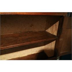 18th century oak larder cupboard, projecting moulded cornice over two panelled doors with shaped arched fielded panels, three short dummy drawers above base fitted with two short and one long drawer, turned handles, on bracket feet