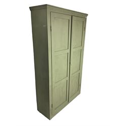 Painted pine cupboard, two panelled doors enclosing four shelves, in laurel green finish