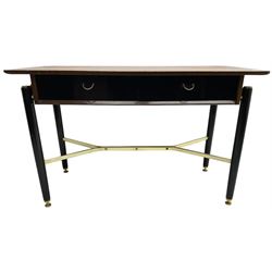 E. Gomme for G-Plan - ‘Librenza’ afrormosia and black finish console, fitted with two drawers, on turned supports united by brass stretchers (W119cm, H74cm, D52cm); together with white painted bedside lamp table (W49cm, H66cm, D50cm)