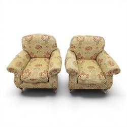 Parker Knoll - 'Henley' floral fabric living room suite, comprising a two seat sofa and pair of armchairs, raised on dark stained turned feet raised on brass castors

Armchairs (H 99cm, W 95cm, D 100cm)