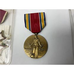 Nine American medals comprising Legion of Merit, Distinguished Flying Cross, Purple Heart named to Dick L. Sparman, Navy Good Conduct Medal, National Defence Service Medal, Army Commendation Medal, two WWII Victory Medals and China Medal; all with ribbons (9)