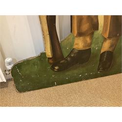 Military Outfitters hand painted life size wooden cut out figure of a WW1 soldier standing at ease holding a gun by his side, marked Stening Signs; hardboard on planked frame H199cm