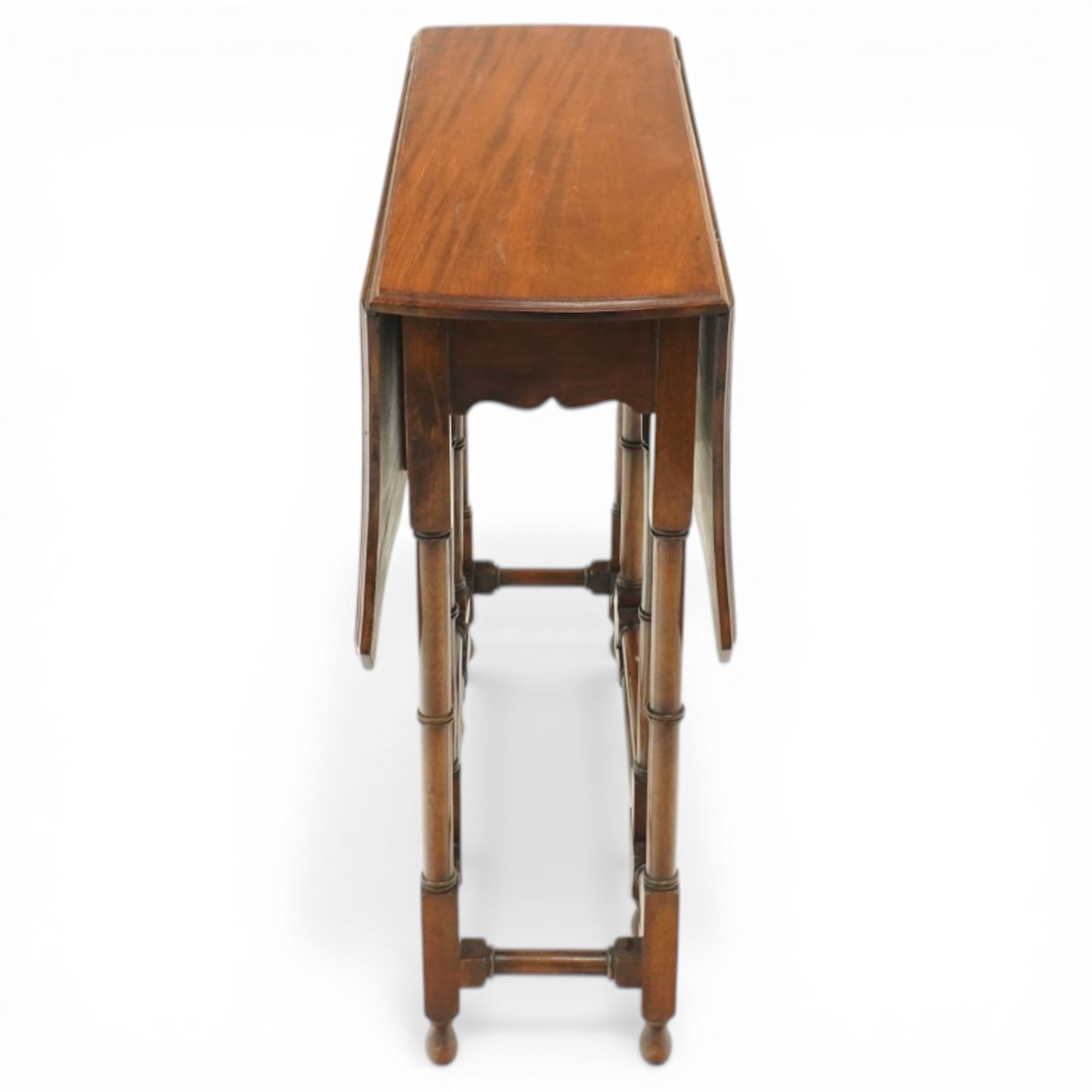 Edwardian mahogany Sutherland table, shaped rectangular drop-leaf top with canted corners and moulded edge, raised on ring-turned gate-leg base united by stretchers