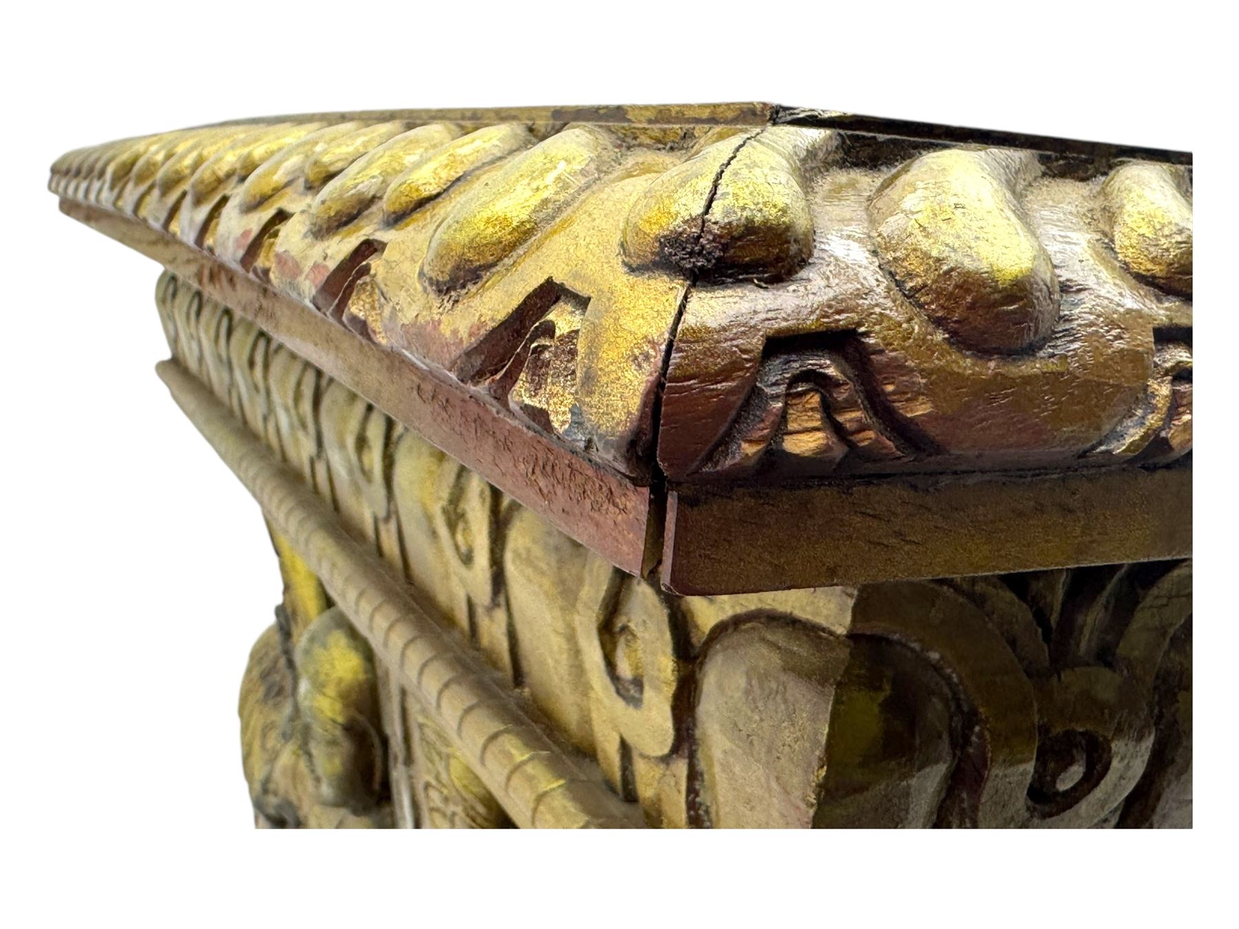 19th century Renaissance Revival carved and giltwood centre table, the rectangular top with gadrooned edge and carved frieze of repeating arched motifs with stylised scrolls, supported by a pair of carved winged griffin supports restrained by a central chained figure, on stepped rectangular bases united by carved stretcher