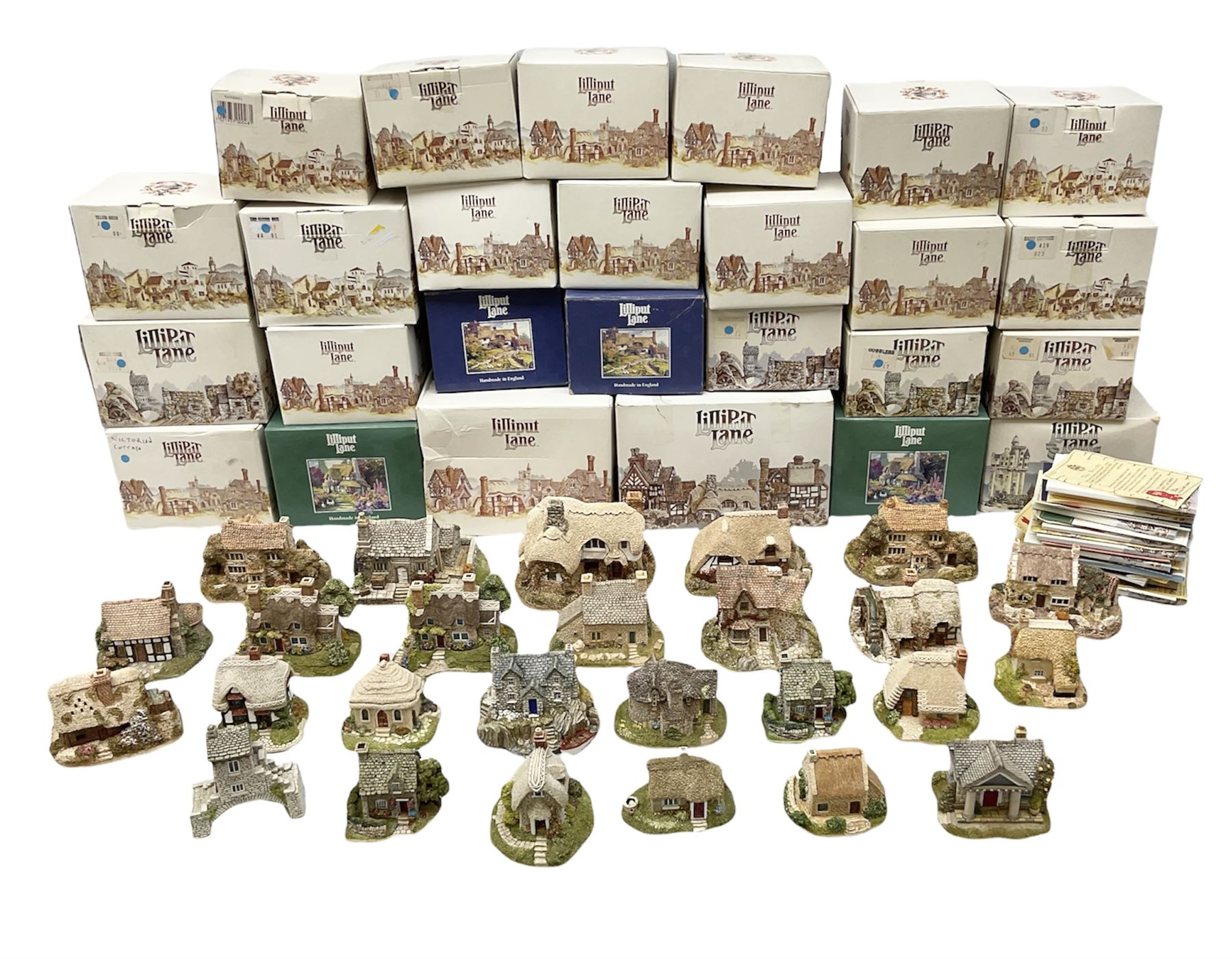 Twenty six Lilliput Lane models from the British and English Collections to include 'Ostlers Keep', 'Holme Dyke', 'Dovetails', 'Victoria cottage' etc, all boxed with deeds