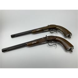 Pair of Muller & Lyon 11mm (approx. .42 cal.) percussion target pistols each with 24.5cm rifled octagonal and fluted barrel, plain action and hammer, unchequered walnut stock with inverted crown shaped butt plate and hooked trigger guard, no set trigger or half cock safety, numbered 1 & 2 on top of breech, L42cm overall; in baize lined fitted walnut case with all accessories including miniature copper powder flask, scissor action bullet mould, nipple key with screw-driver attachment, turned hardwood mallet and graduated pair of lidded boxes, brass rammer, cleaning rod etc, case L55.5cm