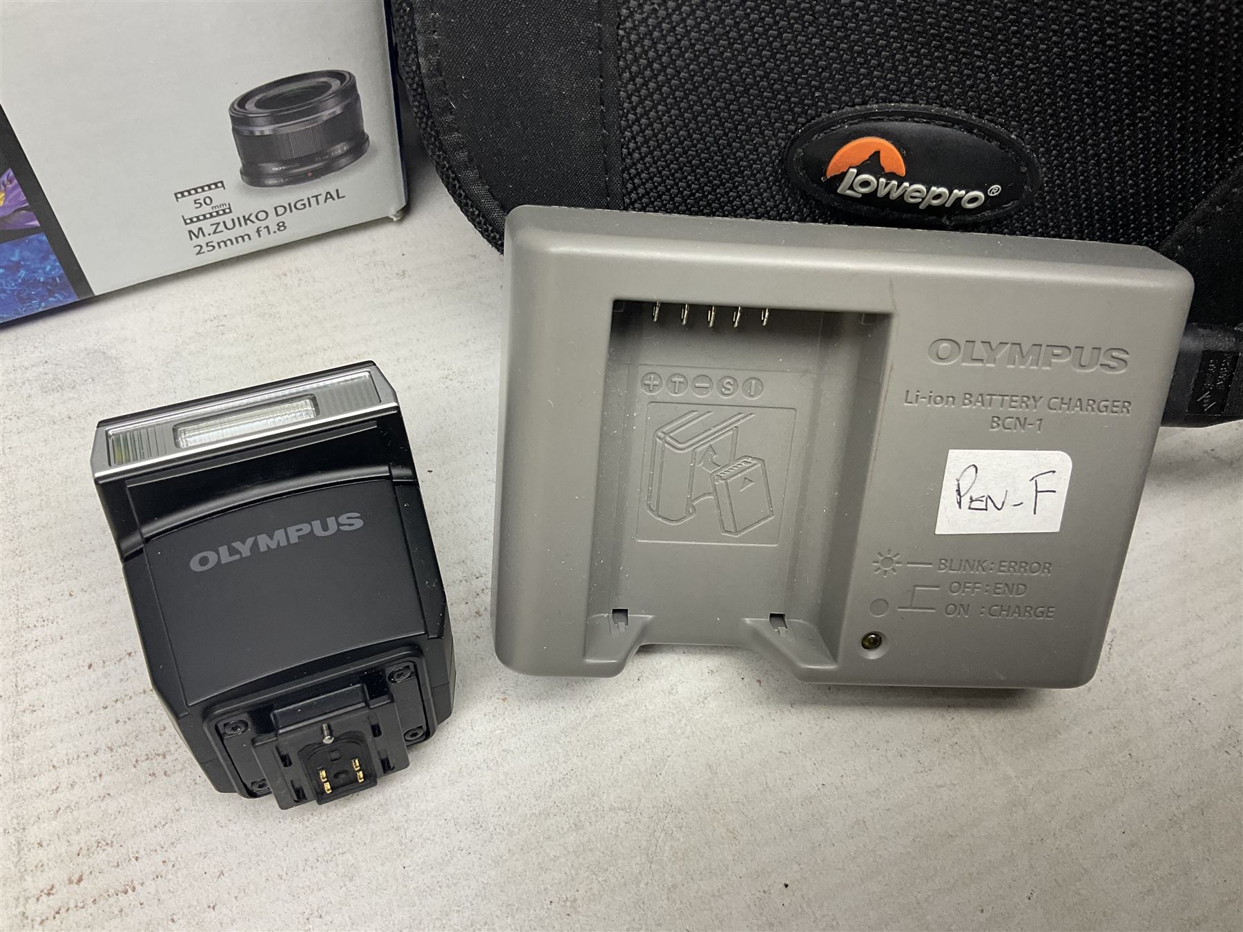 Olympus PEN-F camera body, with 'Olympus M- Zuiko Digital 25mm 1: 1.8' lens,  'Olympus M- Zuiko Digital 75-300mm 1: 4.8 - 6.7' lens and  'Olympus M- Zuiko Digital 17mm 1: 1.8' lens, with original box, together with Lowepro camera bag