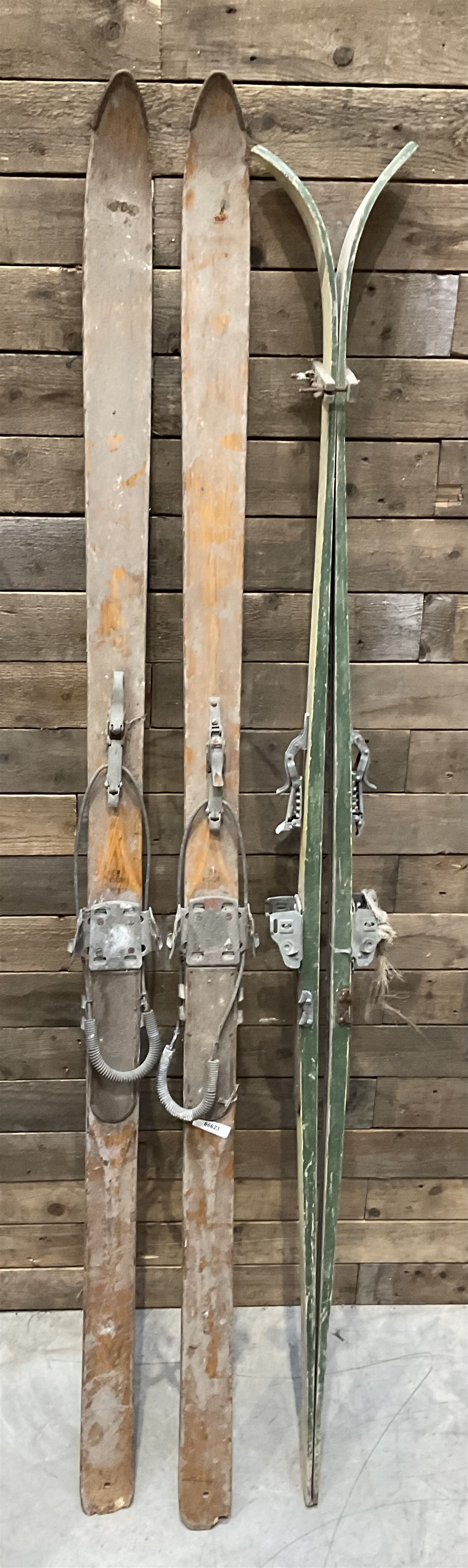 Two pairs of vintage skis, L207cm and 197cm