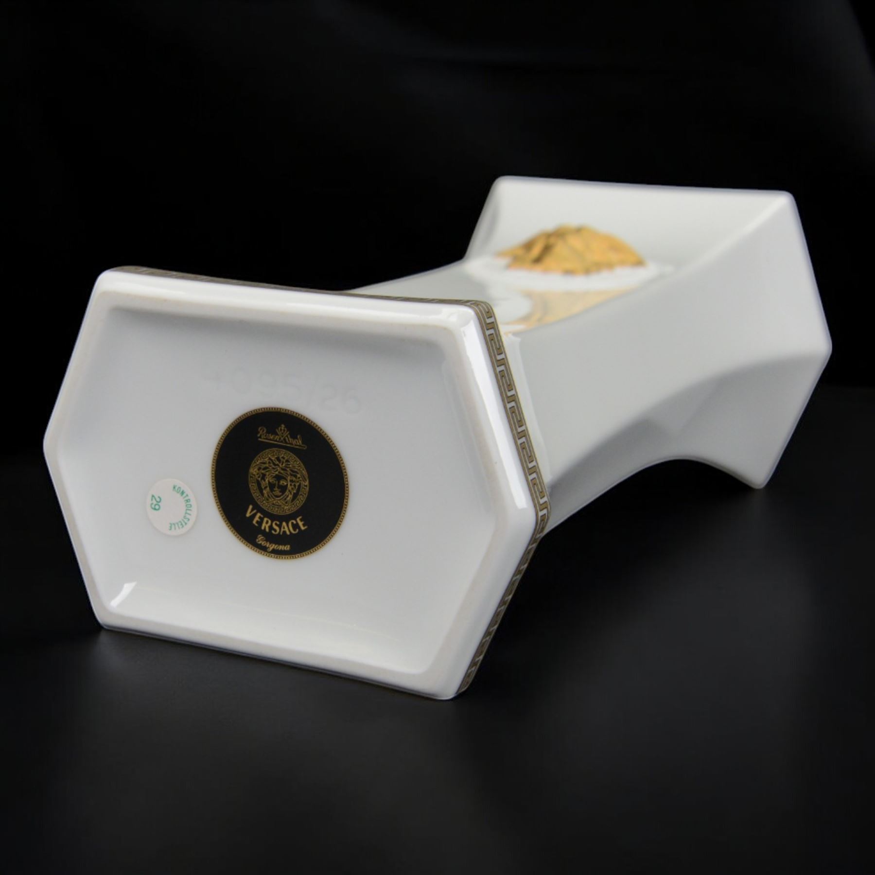 Rosenthal Versace Gorgona vase, of rectagular form with fluted base and rim, decorated in relief with medusa masks and gilt greek key borders upon a white ground, boxed, H25cm