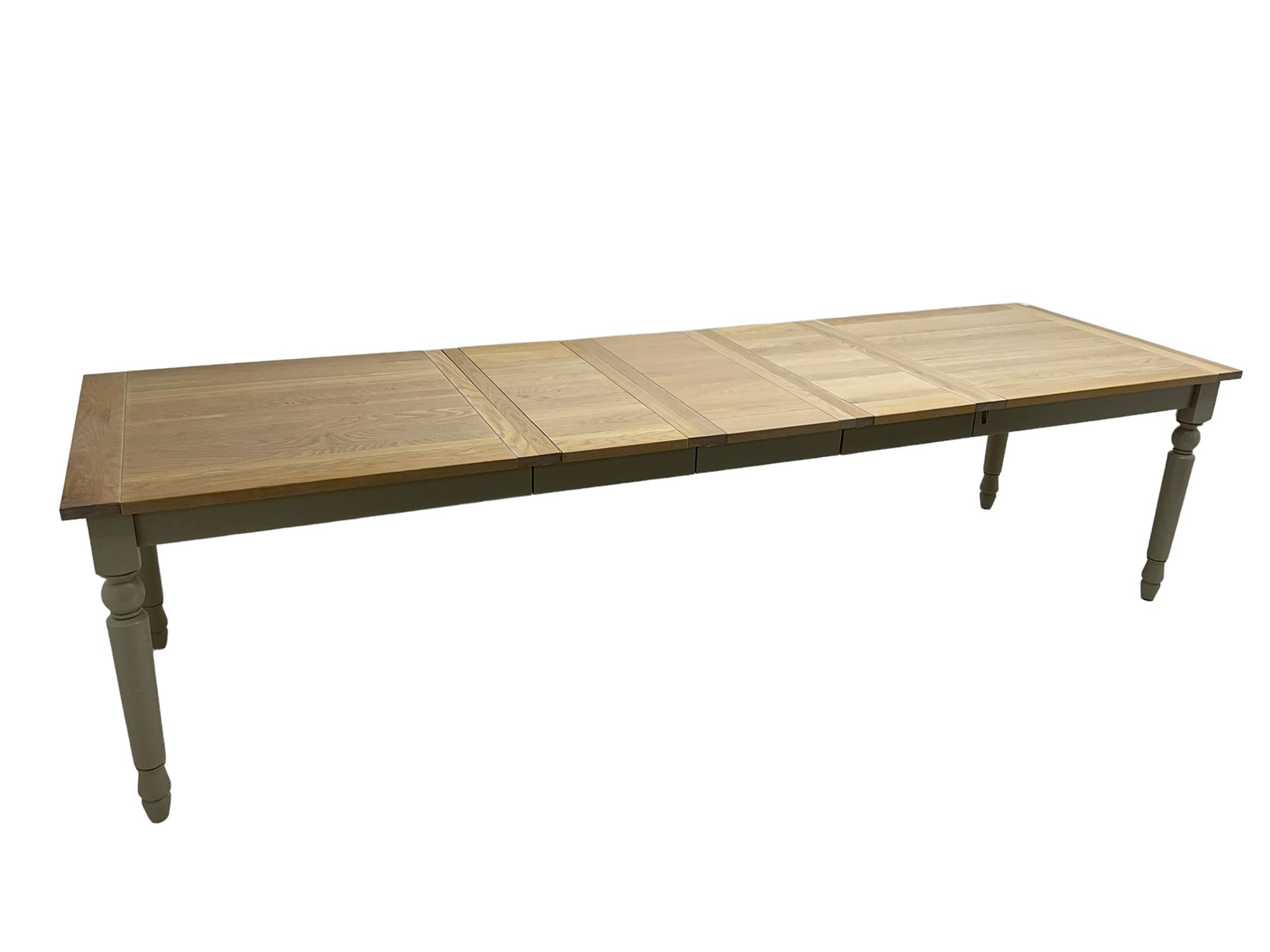 Neptune - 'Suffolk' 8-12 seat extending dining table, rectangular oak with breadboarded ends, on light grey finish base with turned supports, three additional leaves