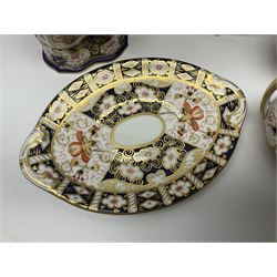 Collection of Royal Crown Derby Imari pattern, comprising covered trinket box, twin handled sucrier and saucer, oval dish and vase, all with printed marks beneath  