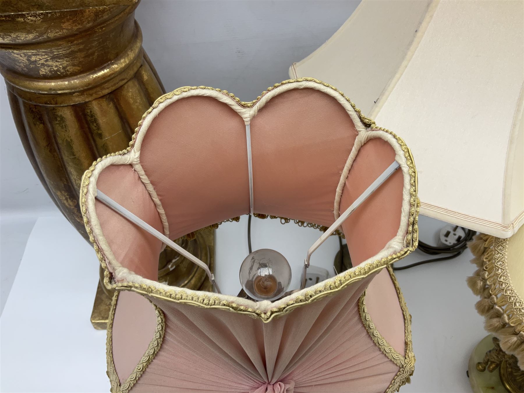 Green onyx and gilt metal table lamp decorated with puttos, together with gilt jardiniere stand and two other table lamps, stand H62cm