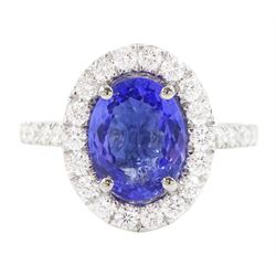 Platinum tanzanite and diamond cluster ring, single oval tanzanite of 2.36 carat, with rou...