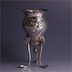 Late Victorian silver vase, of baluster form with fluted rim, the body with embossed floral decoration, upon three tall legs with ramshead mounts, hallmarked William Comyns & Sons, London 1890, H13.5cm