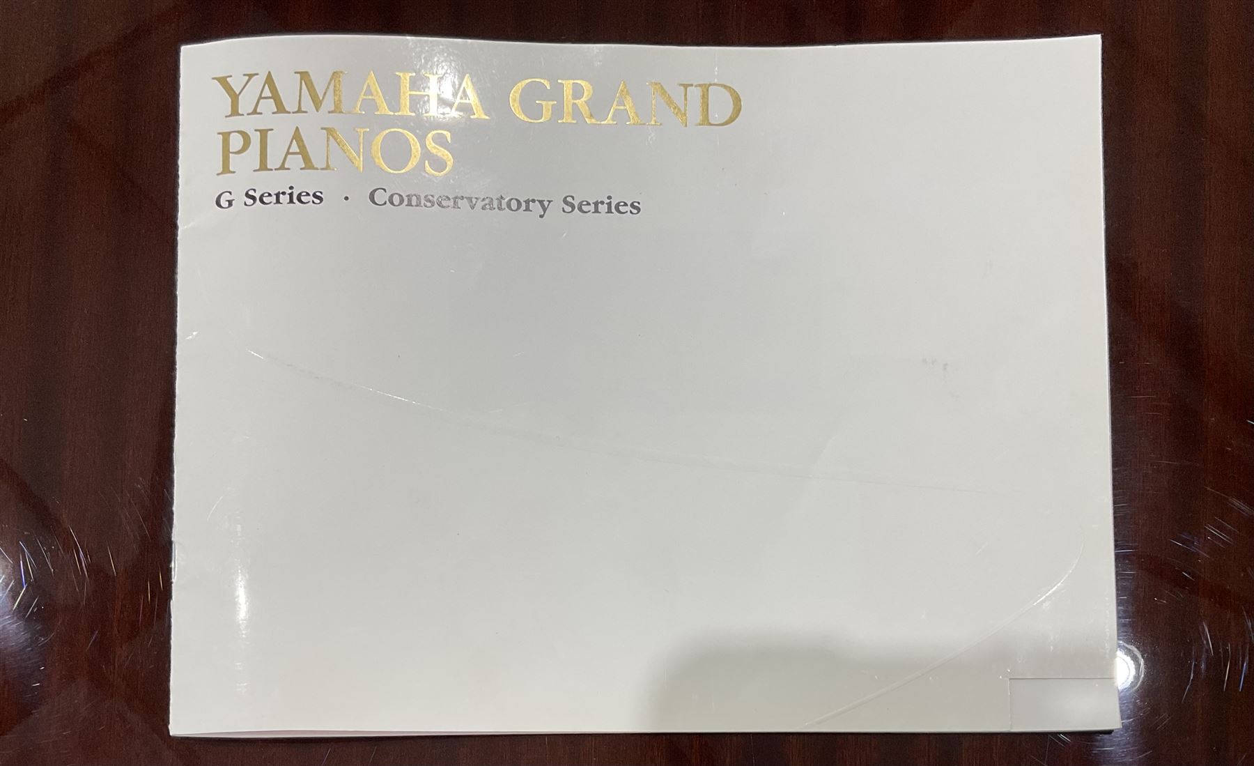 Yamaha - Baby Grand piano in mahogany polyester finish case,  G1 model, serial No 4741647, cast overstrung frame with 88 keys and seven octave compass, original stringing, tuning pins, hammers, dampers and felts, sostenuto, una corda and sustain pedals, with a solid music desk and tapered legs on brass castors.   