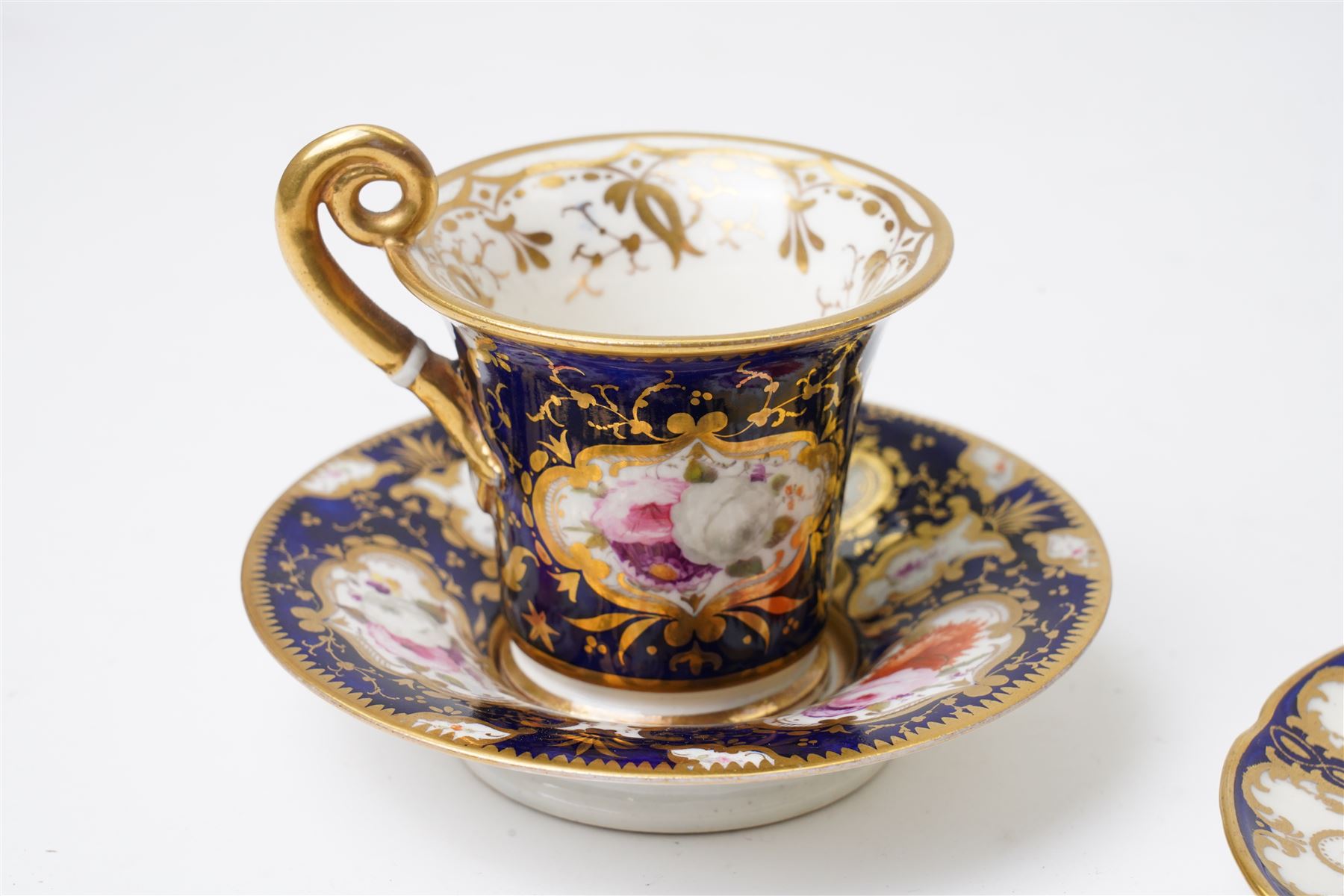 Grainger Lee & Co Worcester teacup, together with a collection of cobalt blue cabinet cups and saucers,  including a Royal Doulton hand-painted example by E Percy, and various others 19th century and later, mostly unmarked (7 pairs)