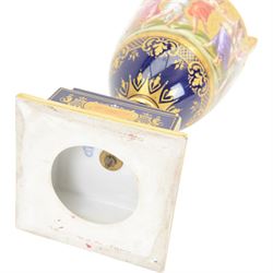 Late 19th century Vienna twin handled urn and cover decorated with classical figures on a textured gilt ground,  upon a square stepped cobalt blue pedestal with gilt detailing, H36cm