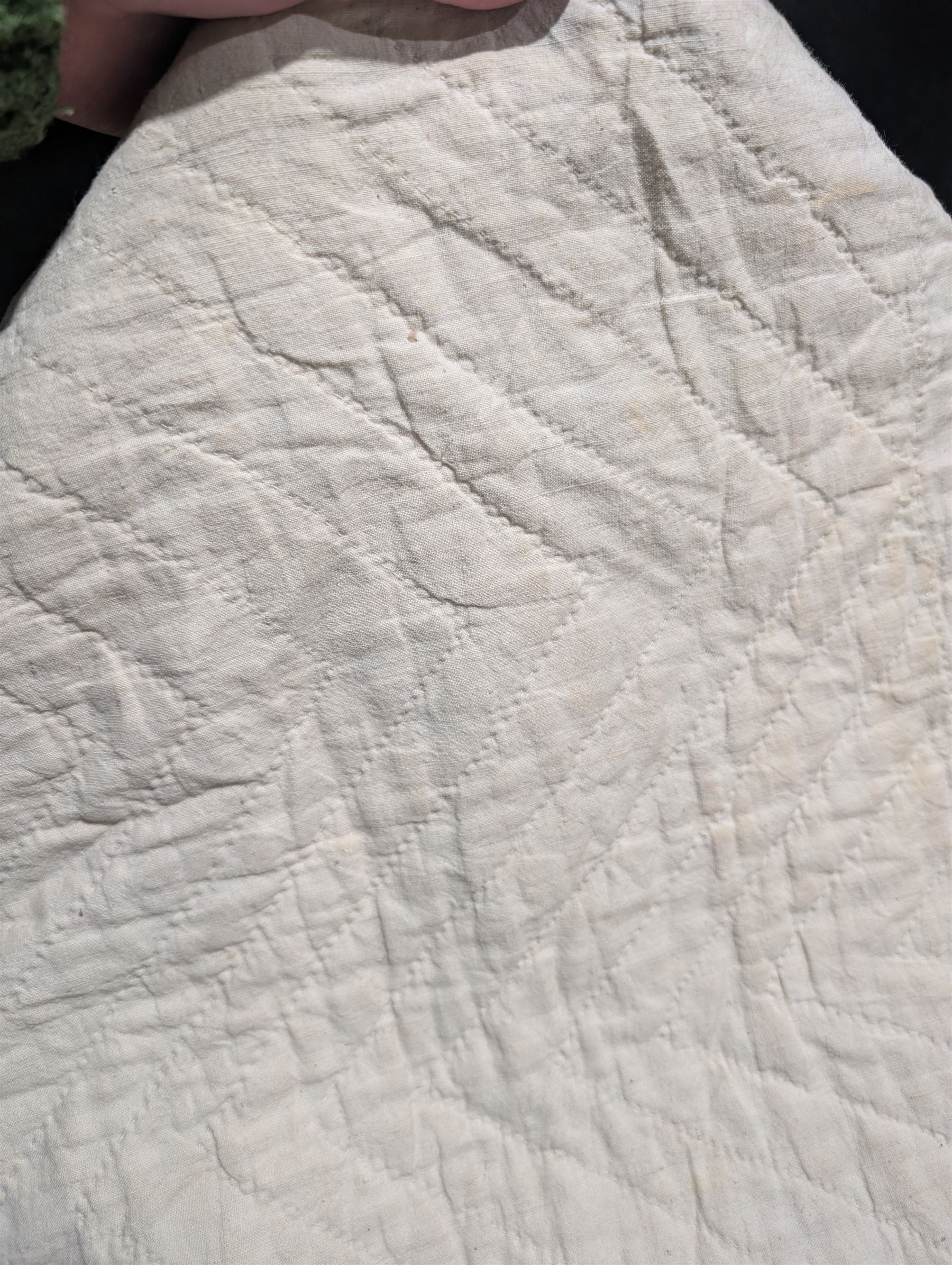 Handmade large patchwork quilt bedspread made up of individual squares of multi-coloured cottons and backed in a cream cotton, 243cm x 284cm 