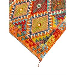 Chobi Kilim rug, multi-coloured ground in oranges, blues and greens, overall geometric design 