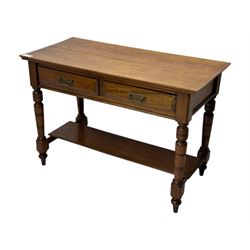 Victorian mahogany side table fitted with two drawers,  rectangular top over two short drawers with moulded facias and brass drop handles, turned front and rear supports joined by an open undertier, on turned feet 