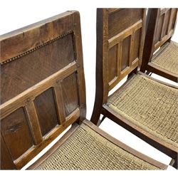 'Gnomeman' set of three oak dining chairs, panelled backs over curved seat rails with drop in rope rush seats, turned front supports with collar joined by plain stretchers, two with carved seated gnome figures, painted

Provenance - This collection of early 'Gnomeman' furniture comes to us directly from the Whittaker family. The pieces were made by the vendor's father Thomas Whittaker in the 1930/40s for his own use. During this time, he lived in York and made items for himself and friends. Whittaker adopted the gnome as a signature and trademark after his move to Littlebeck, Whitby.