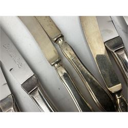 Four butter knives with hallmarked silver handles together with a Quantity of silver-plated cutlery stamped Ashberry and other stainless steel cutlery