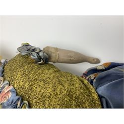 Victorian large wax over composition Pumpkin head doll, with inset dark glass eyes, moulded blonde hair in curls, stuffed body with carved and painted wooden limbs, grey painted boots, floral satin dress with netting underclothes H61cm