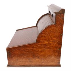 Victorian oak perpetual calendar roll-top desk, tambour front enclosing fitted interior with pigeonholes and pen trays, the raised back fitted with rotating date and month apertures, over single frieze drawer with cast brass handle, on plinth base