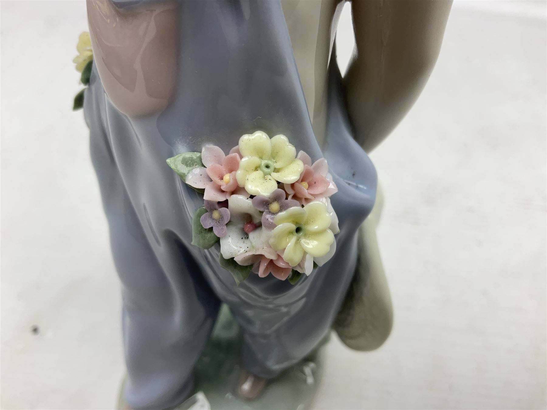 Three Lladro figures comprising, Pocket Full of Wishes no 7650, School Days no 7604 and Spring Bouquets no 7603, all with original boxes, largest example H26cm  