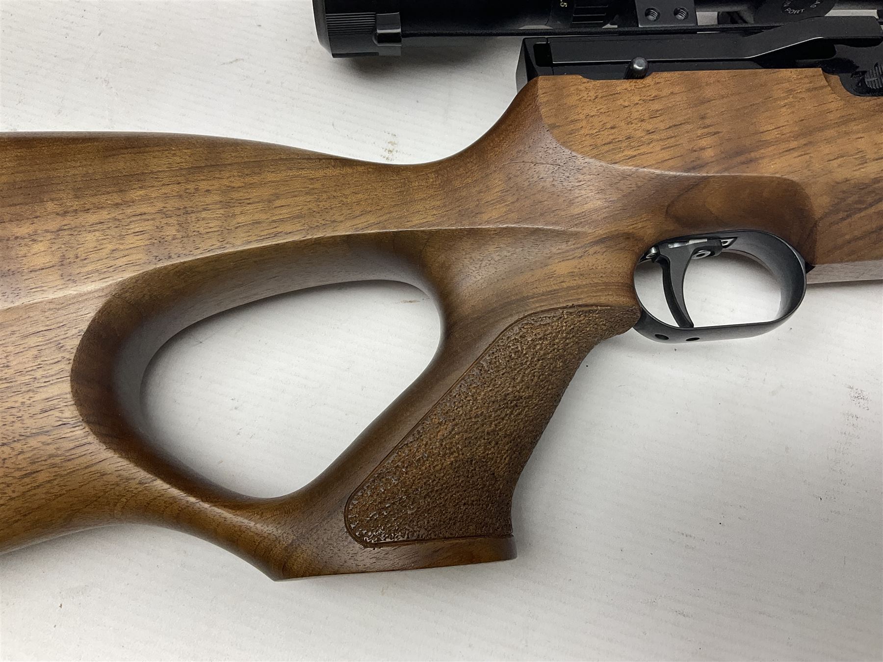 Weihrauch Sport HW100 .177 calibre PCP repeating air rifle; walnut thumbhole stock with textured pistol-grip; fourteen-shot magazine; Nikko Stirling Gameking 3.5 -10x44 illuminated telescopic sight; No.1922087 L90cm overall; in Napier fleece lined gun sling; with re-filling air tank and quantity of pellets NB: AGE RESTRICTIONS APPLY TO THE PURCHASE OF AIR WEAPONS.