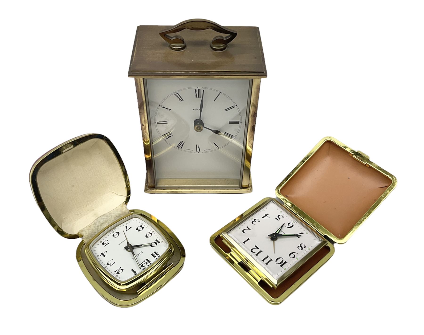 Two travelling alarm clocks with leather effect cases to include a