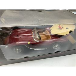 Two Collezione Classico large scale die-cast models of a Ferrari 1972 312P with Racing Fuel Pump and Ferrari 1958 250 Testa Rossa with Road Fuel Pump; and two Minichamps 1:18 scale models of a McLaren Mercedes Racing Car and Auto Union Typ C racing car; all boxed (4)