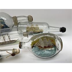A group of five various sized 'Ship-in-a-bottle' ornaments, largest example H49cm. 