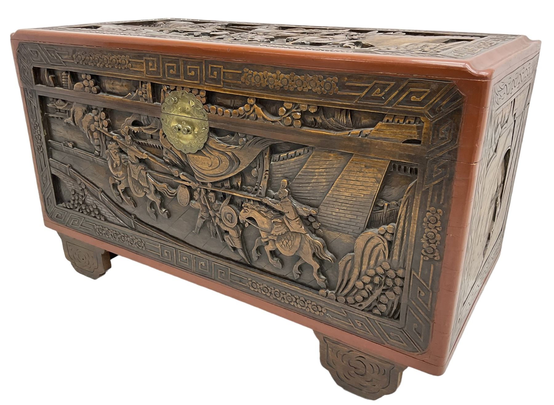 Mid-20th century Singapore camphor wood blanket chest, heavily carved depicting battle scenes and cityscapes 