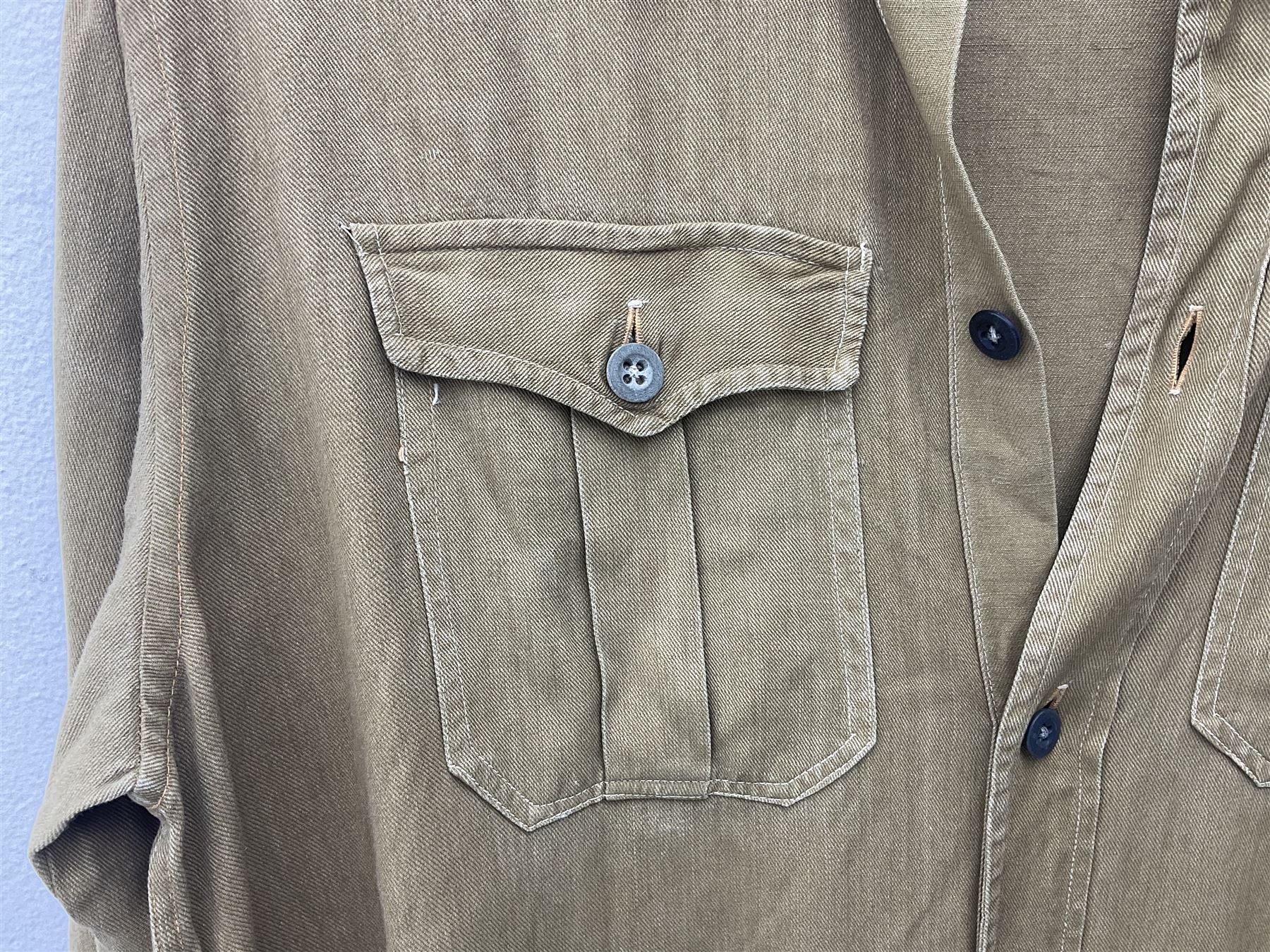 1930s Hitler Youth brown shirt, long length with two pockets, bears triangular badge 'Nord Nordsee'