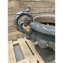 Victorian design ornate cast iron centrepiece urn, featuring two handles, raised on footed base
