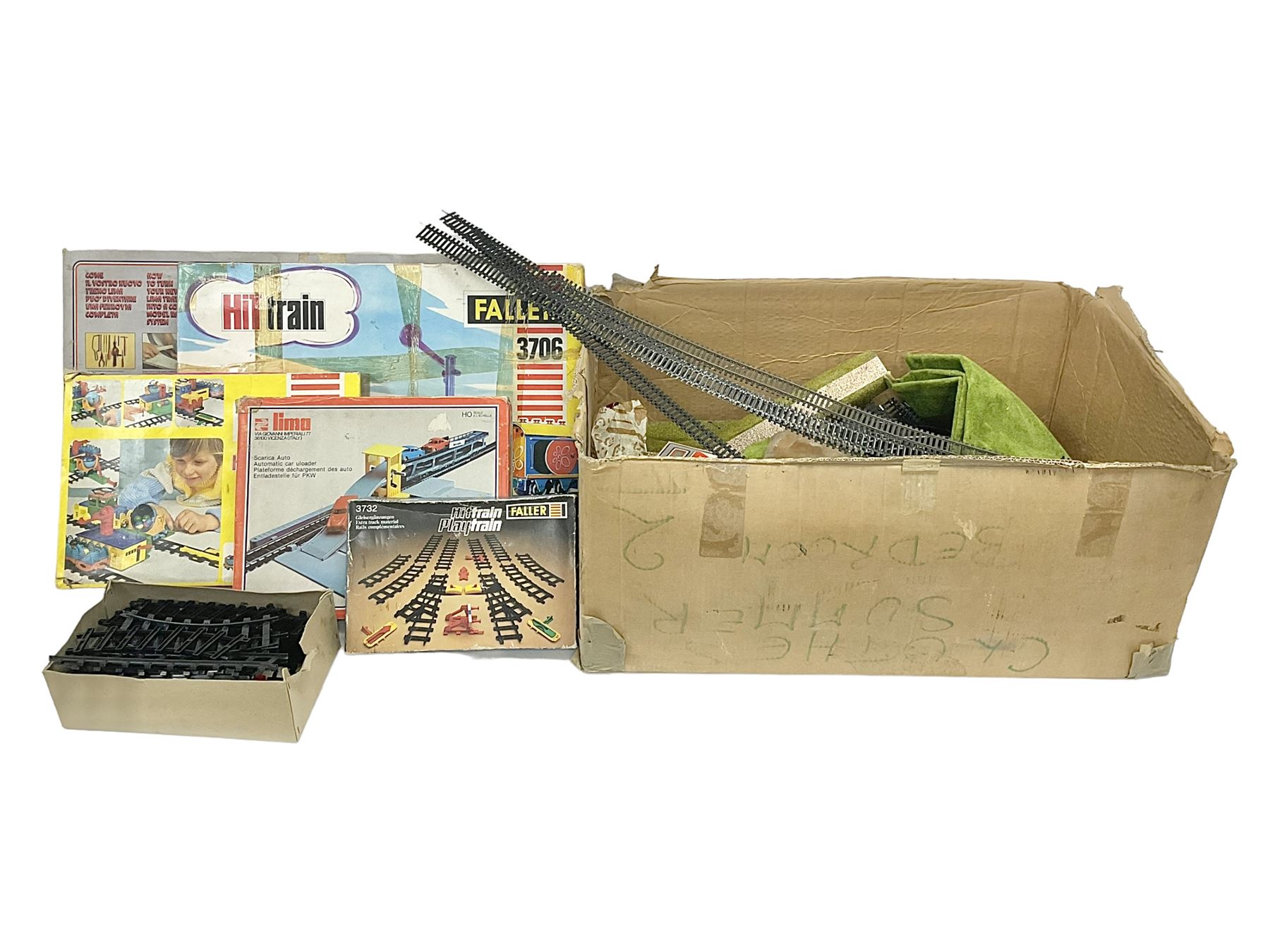 Large quantity of toy railway collectables, to include Faller ‘Hit Train’ boxed sets 3706, 3732, 3753; Lima automatic car unloader, quantity of track and accessories, etc in two boxes 