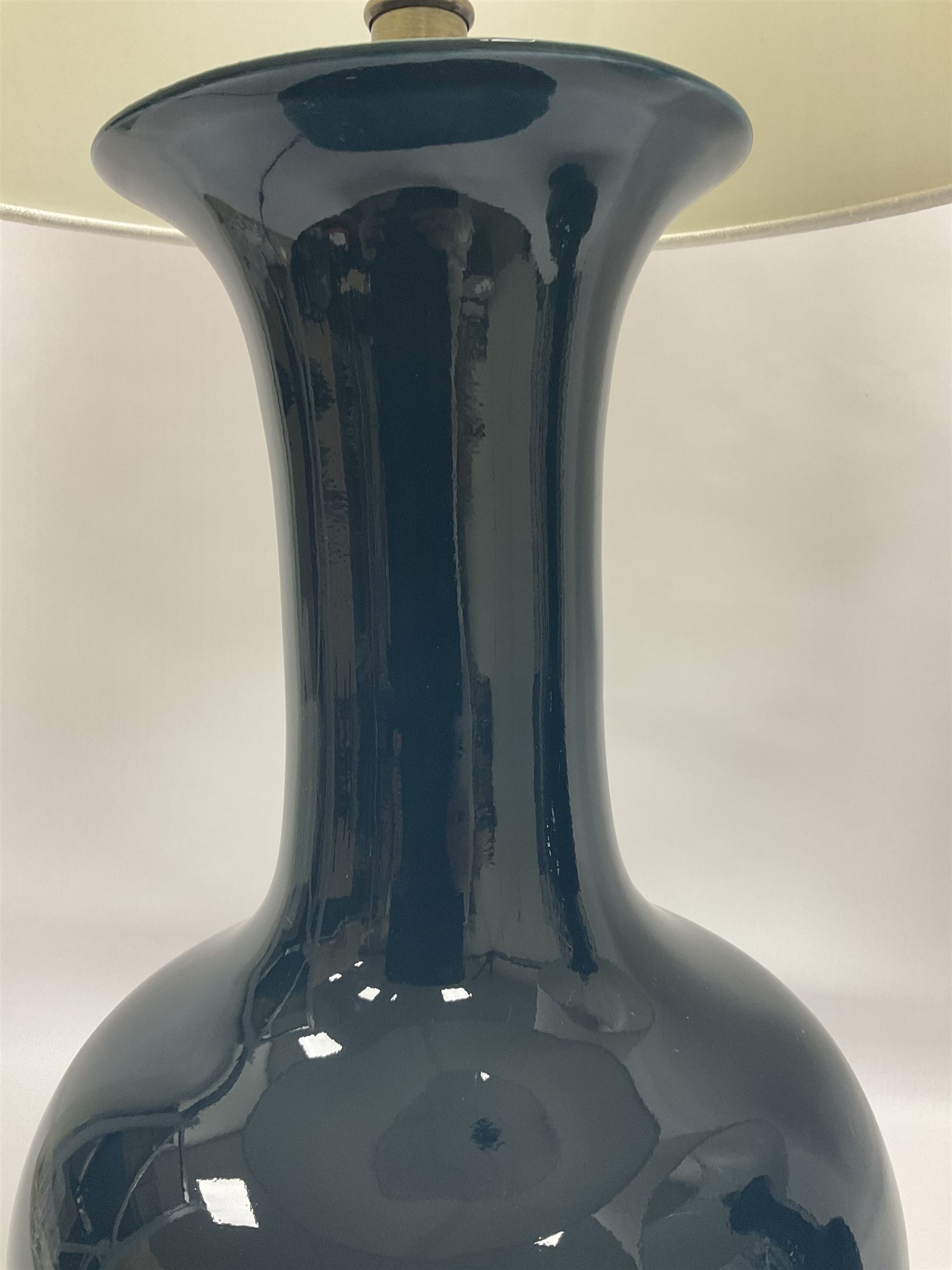 Pair of Chinese teal glazed table lamps, each of bottle form, raised upon circular hardwood bases, including shade H72cm 